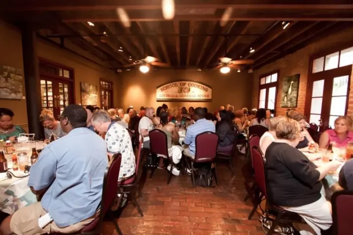 a group of people sitting at a table in a room