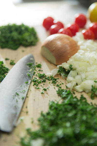 a piece of broccoli on a cutting board