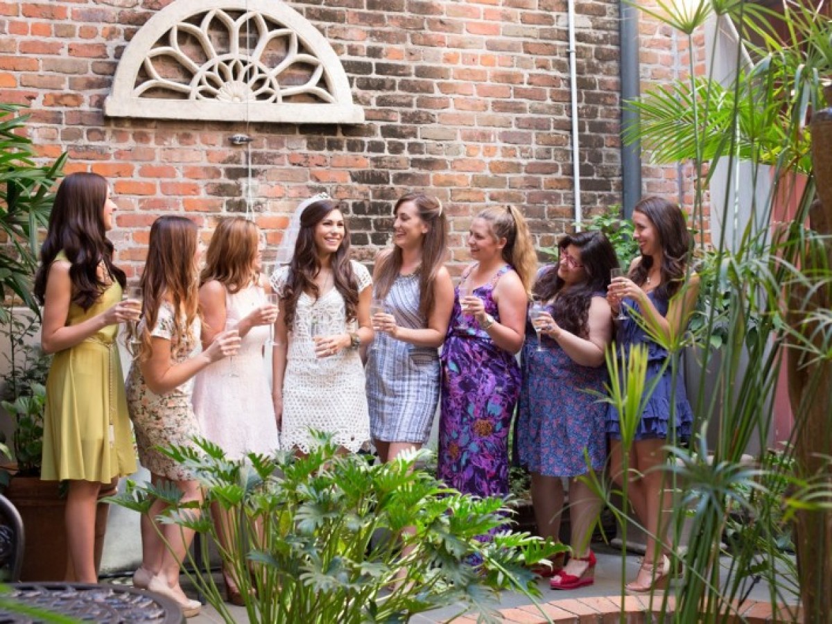 a group of people standing in front of a building