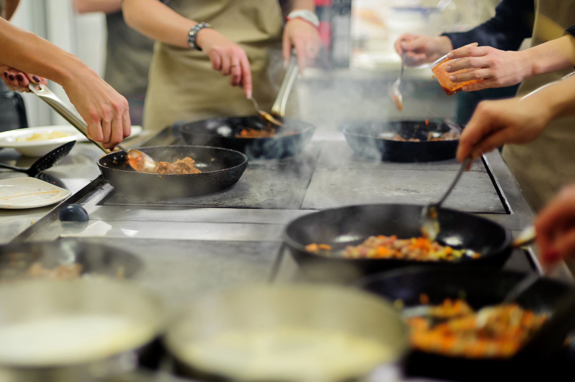 Four people enjoy a hands-on cooking class in New Orlean's French Quarter.
