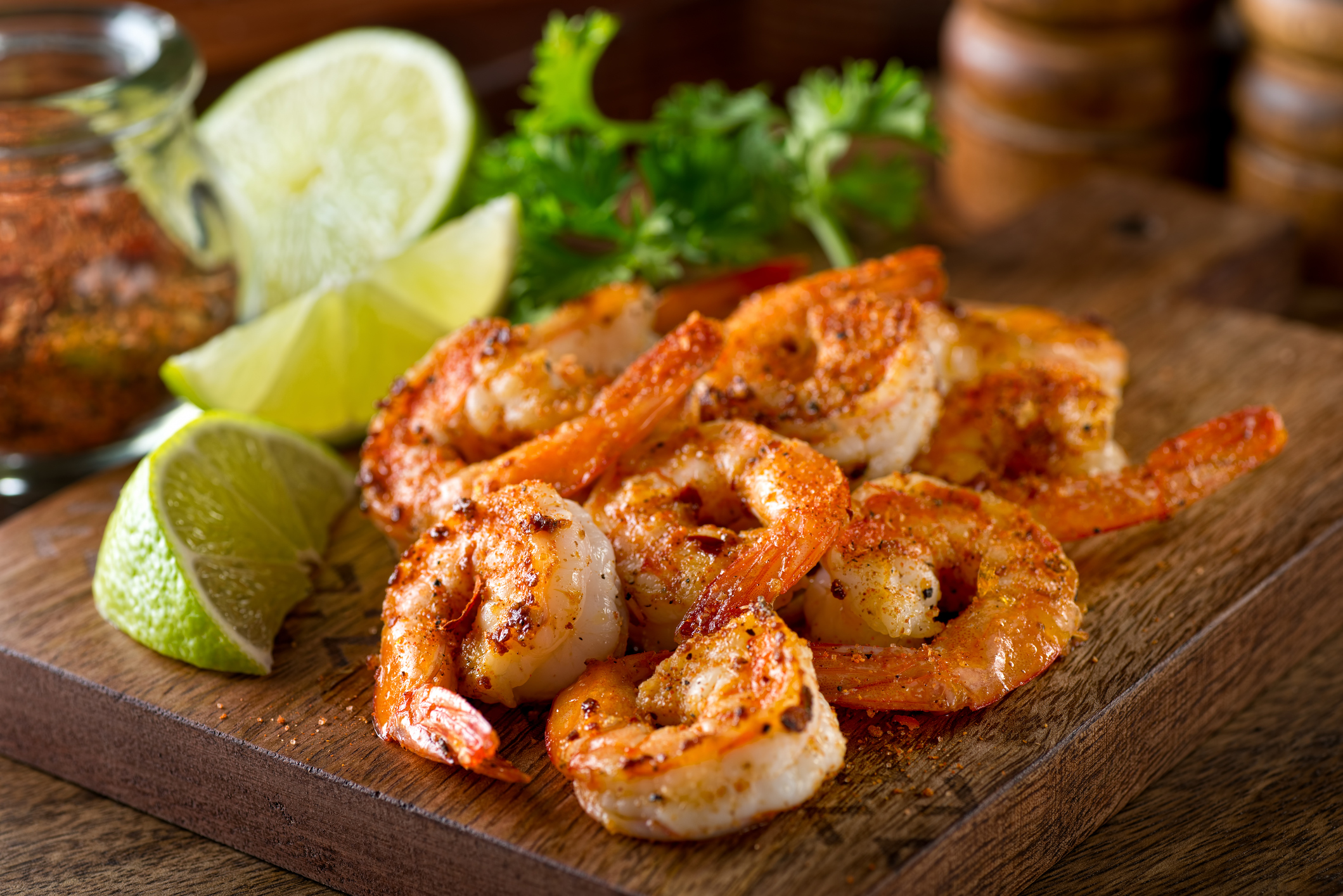 Delicious sauteed shrimp with cajun seasoning and lime on a maple plank.